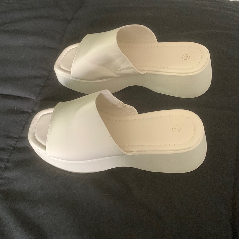 Platform slides in cream color.